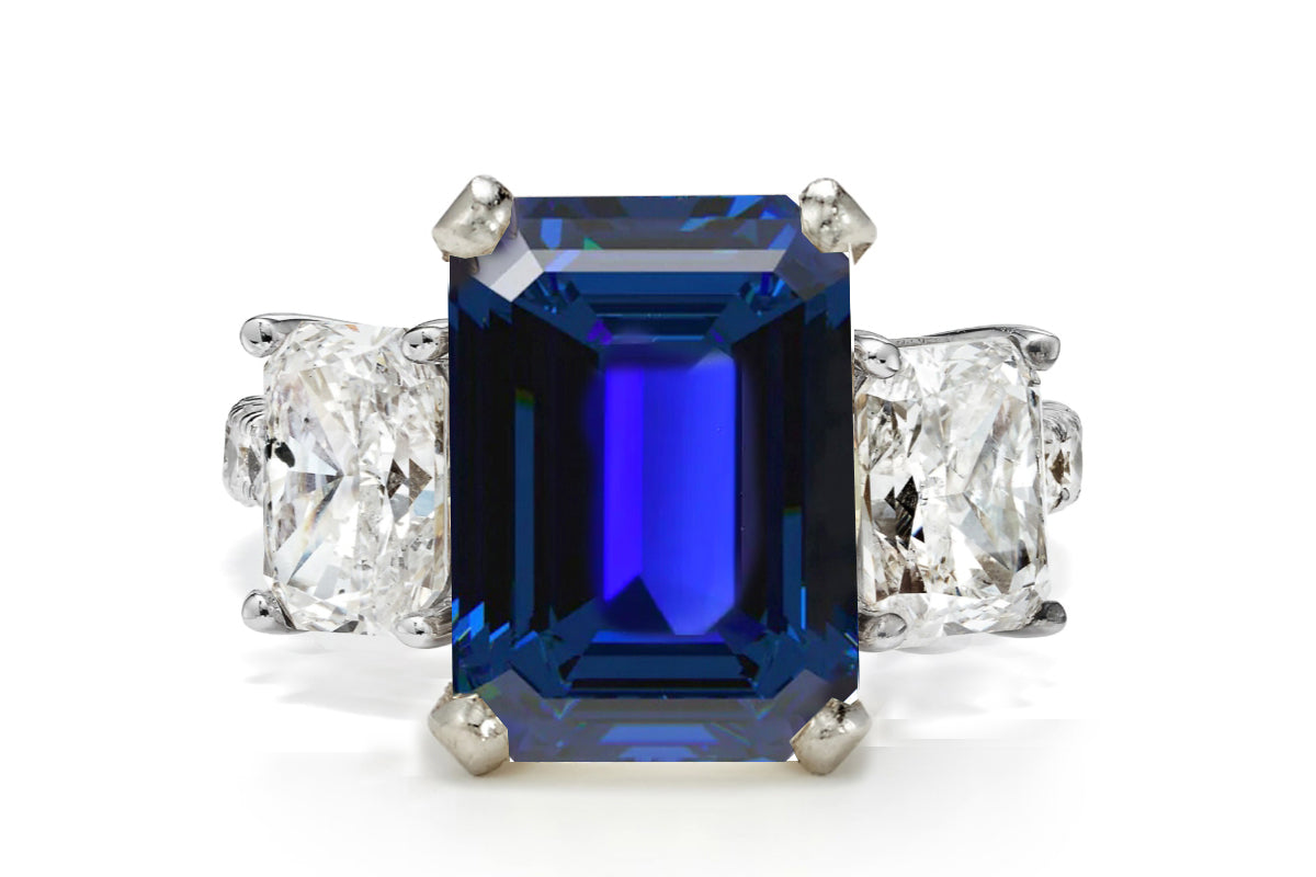 506 custom made unique emerald cut blue sapphire center stone and asscher cut diamond accents three stone engagement ring