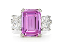 506 custom made unique emerald cut pink sapphire center stone and asscher cut diamond accents three stone engagement ring