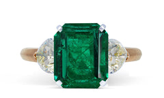 51 custom made unique emerald cut emerald center stone with heart diamond accents three stone engagement ring