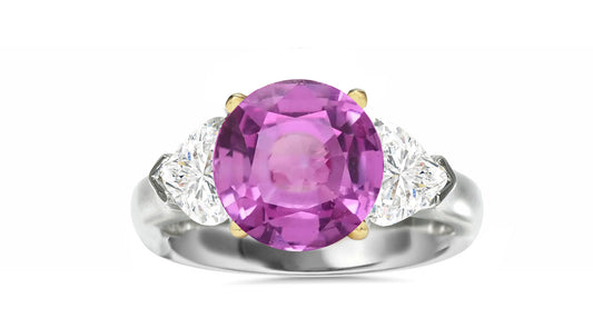 510 custom made unique round pink sapphire center stone and heart diamond accent three stone engagement ring