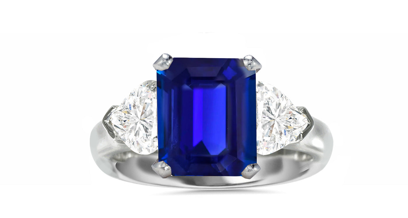 513 custom made unique emerald cut blue sapphire center stone and heart diamond accent three stone engagement ring