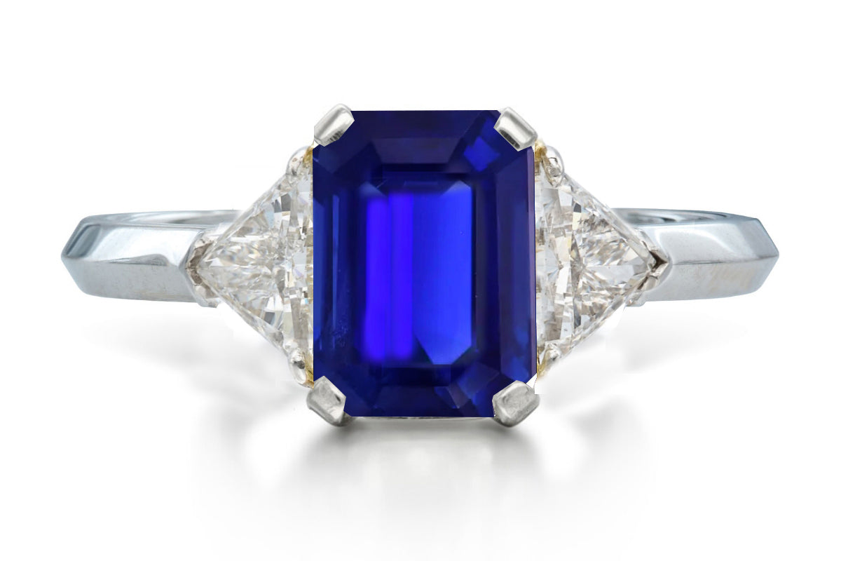 515 custom made unique emerald cut blue sapphire center stone and trillion diamond accent three stone engagement ring