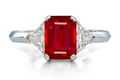 515 custom made unique emerald cut ruby center stone and trillion diamond accent three stone engagement ring