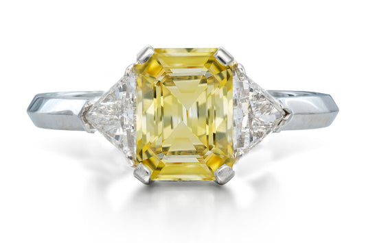 515 custom made unique emerald cut yellow sapphire center stone and trillion diamond accent three stone engagement ring