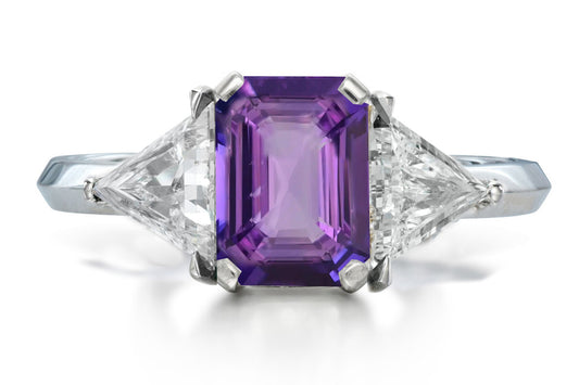 516 custom made unique emerald cut purple sapphire center stone and trillion diamond accent three stone engagement ring