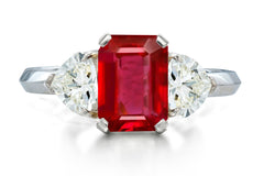 517 custom made unique emerald cut ruby center stone and heart diamond accent three stone engagement ring