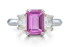 518 custom made unique emerald cut pink sapphire center stone and trapezoid diamond accent three stone engagement ring