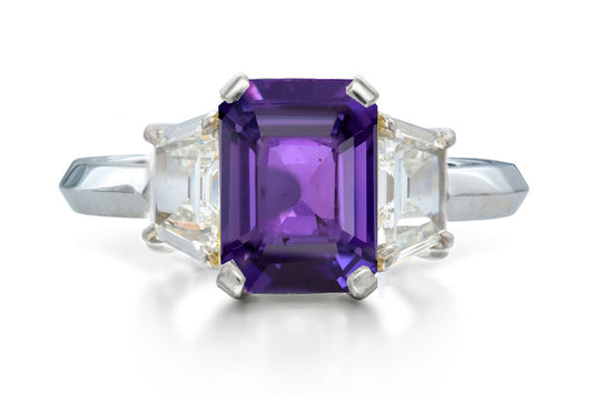 518 custom made unique emerald cut purple sapphire center stone and trapezoid diamond accent three stone engagement ring