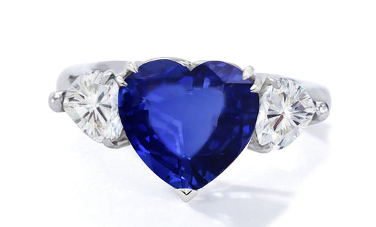 522 custom made unique heart blue sapphire center stone and heart diamond accent three stone engagement ring