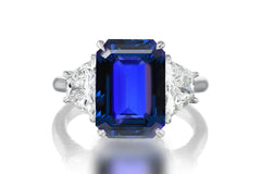 523 custom made unique emerald cut blue sapphire center stone and trapezoid diamond accent three stone engagement ring