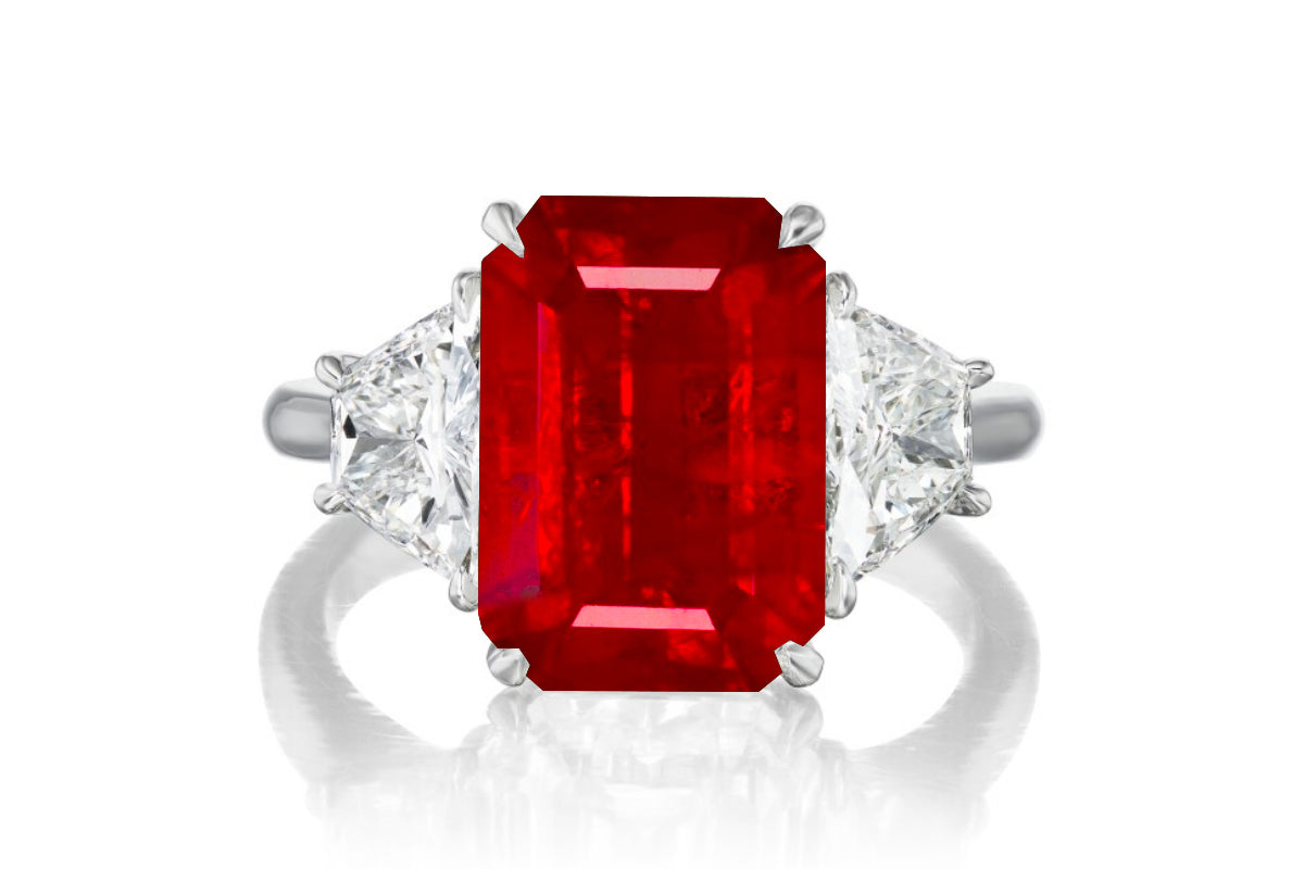 523 custom made unique emerald cut ruby center stone and trapezoid diamond accent three stone engagement ring