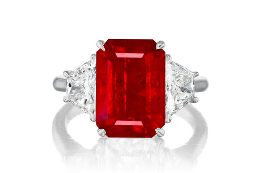 523 custom made unique emerald cut ruby center stone and trapezoid diamond accent three stone engagement ring