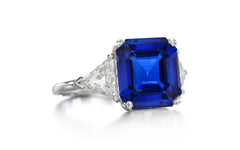 525 custom made unique asscher cut blue sapphire center stone and trillion diamond accent three stone engagement ring