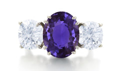 550 custom made unique oval purple sapphire center stone and round diamond accent three stone engagement ring