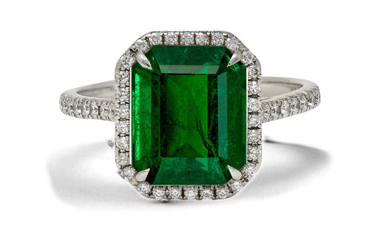 6 custom made emerald and diamond vintage halo engagement rings