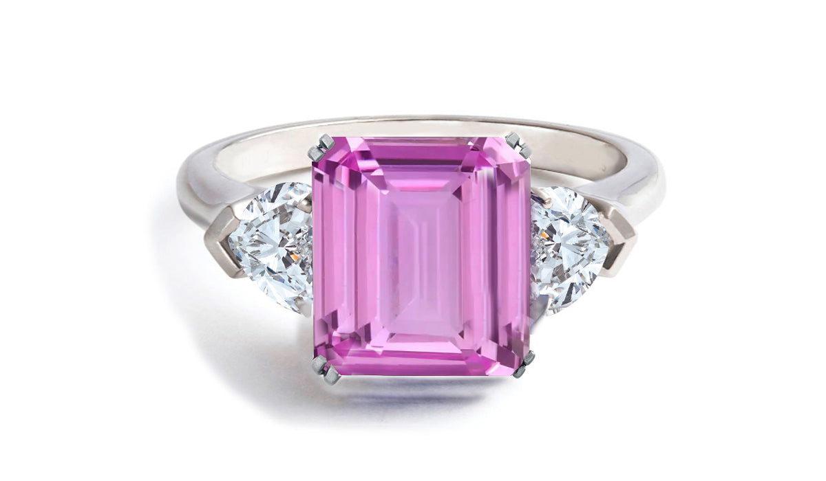 605 custom made unique emerald cut pink sapphire center stone and heart diamond three stone engagement ring