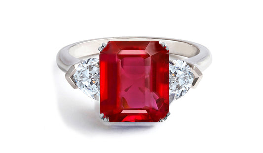 605 custom made unique emerald cut ruby center stone and heart diamond three stone engagement ring