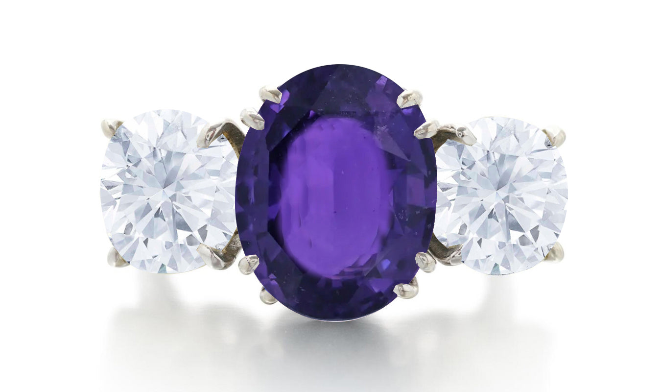 606 custom made unique oval purple sapphire center stone and round diamond three stone engagement ring