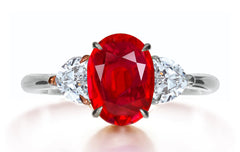 615 custom made unique oval ruby center stone and heart diamond side three stone engagement ring