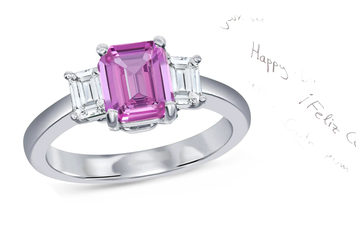 62 custom made unique emerald cut pink sapphire center stone and emerald cut diamond accent three stone engagement ring