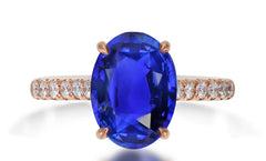 620 custom made unique oval blue sapphire center stone and prong set diamond accent band engagement ring