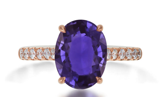 620 custom made unique oval purple sapphire center stone and prong set diamond accent band engagement ring