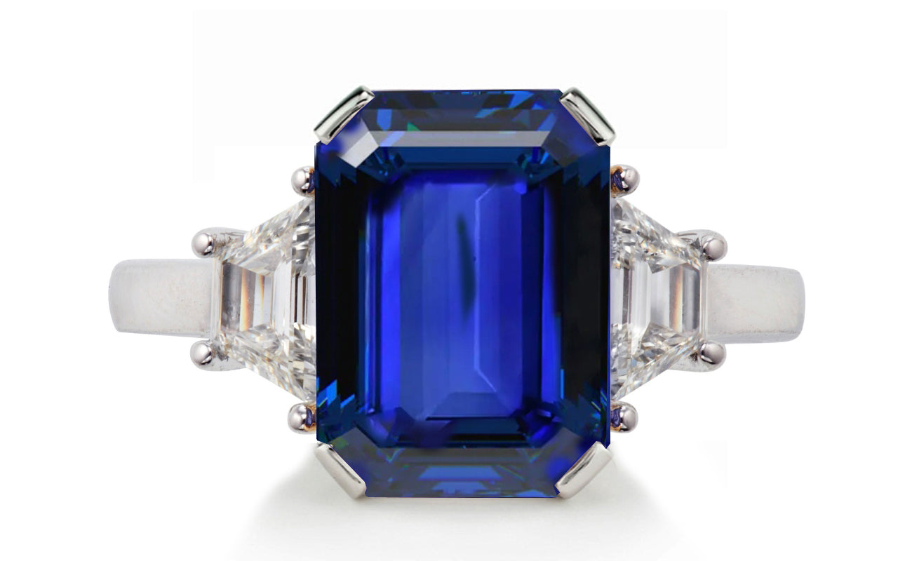 623 custom made unique emerald cut blue sapphire center stone and trapezoid diamond accent three stone engagement ring