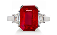 623 custom made unique emerald cut ruby center stone and trapezoid diamond accent three stone engagement ring