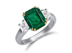 624 custom made unique emerald cut emerald center stone and square diamond accent three stone engagement ring