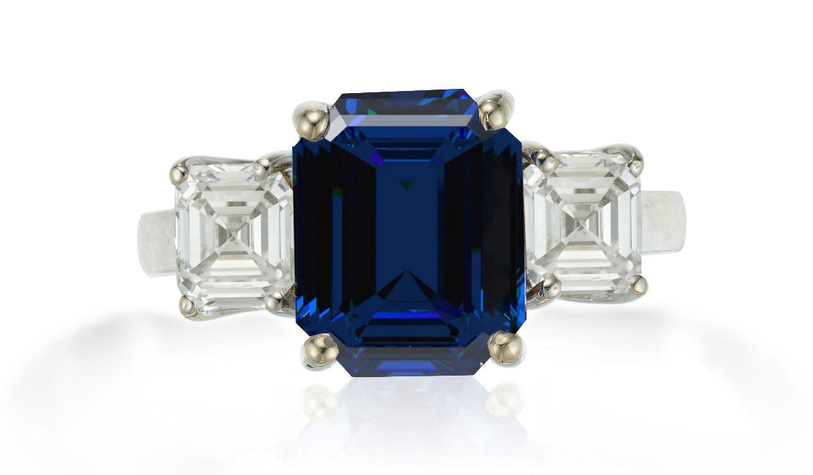 625 custom made unique emerald cut blue sapphire center stone and asscher cut diamond accent three stone engagement ring