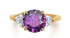 628 custom made unique round purple sapphire center stone and heart diamond accent three stone engagement ring