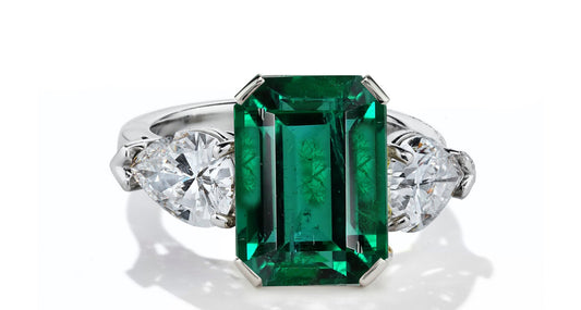 630 custom made unique emerald cut emerald center stone and pears diamond accent three stone engagement ring