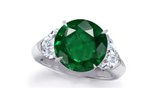 637 custom made unique round emerald center stone and heart diamond accent three stone engagement ring