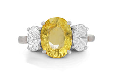 646 custom made unique oval yellow sapphire center stone and oval diamond accent three stone engagement ring