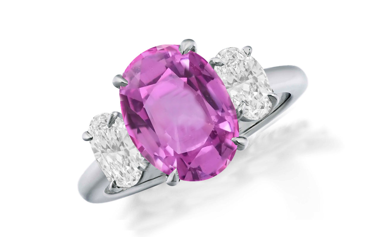 648 custom made unique oval pink sapphire center stone and oval diamond accent three stone engagement ring