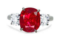 650 custom made unique oval ruby center stone and round diamond accent three stone engagement ring