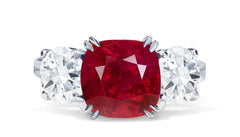 651 custom made unique cushion ruby center stone and round diamond accent three stone engagement ring