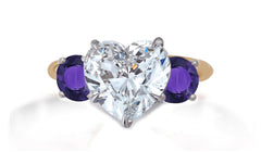 653 custom made unique heart diamond center stone and round purple sapphire accent three stone engagement ring