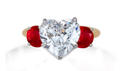 653 custom made unique heart diamond center stone and round ruby accent three stone engagement ring