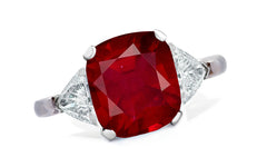 654 custom made unique cushion ruby center stone and trillion diamond accent three stone engagement ring