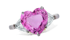 659 custom made unique heart pink sapphire center stone and trillion diamond accent three stone engagement ring