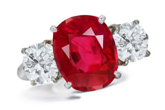 663 custom made unique oval ruby center stone and round diamond accent three stone engagement ring