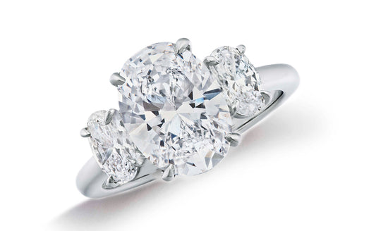 664 custom made unique oval diamond center stone and oval diamond accent three stone engagement ring