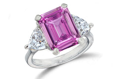 669 custom made unique emerald cut pink sapphire center stone and heart diamond accent three stone engagement ring