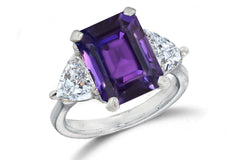 669 custom made unique emerald cut purple sapphire center stone and heart diamond accent three stone engagement ring