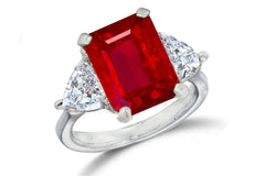 669 custom made unique emerald cut ruby center stone and heart diamond accent three stone engagement ring