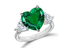 670 custom made unique heart emerald center stone and heart diamond accent three stone engagement ring