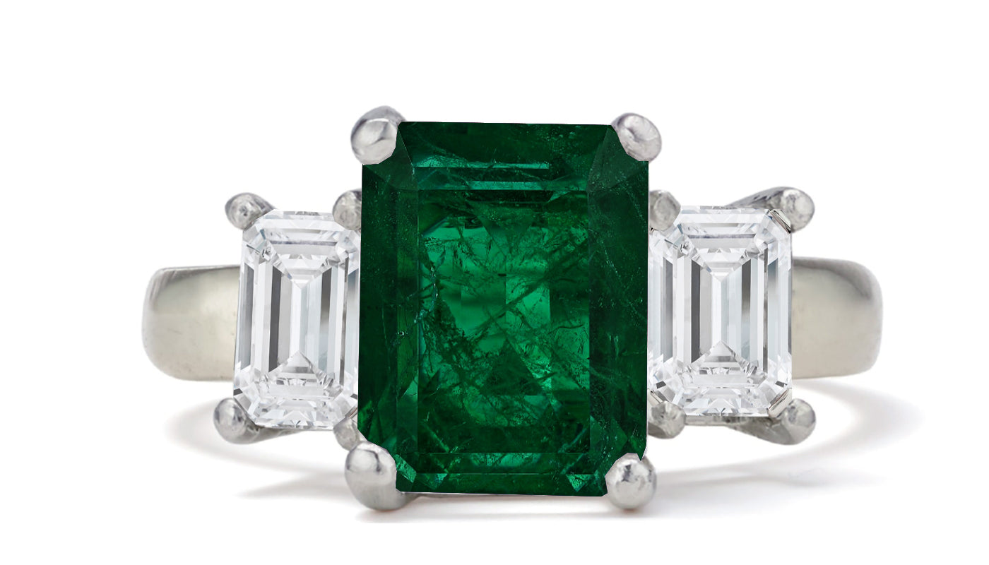 682 custom made unique emerald cut emerald center stone and emerald cut diamond accent three stone engagement ring