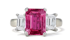 682 custom made unique emerald cut pink sapphire center stone and emerald cut diamond accent three stone engagement ring