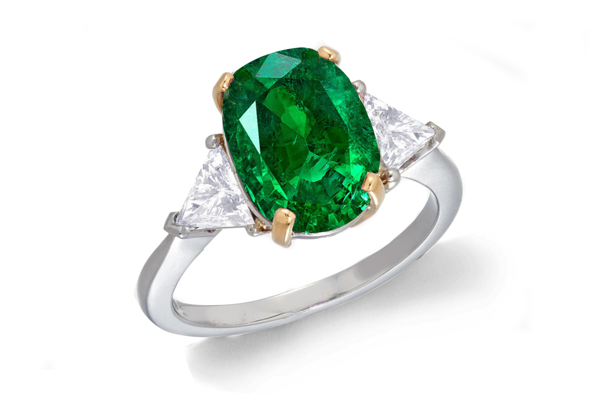 685 custom made unique oval emerald center stone and trillion diamond accent three stone engagement ring